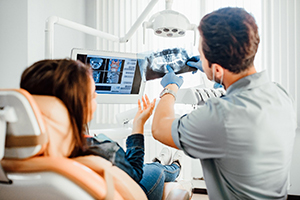 Dallas dentist explaining X-ray to patient