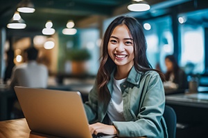 a smiling person sitting in a coffee shop