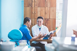 a patient speaking to a dentist