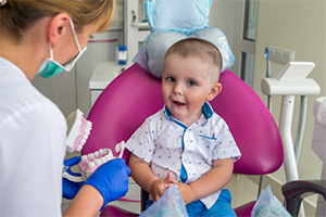 Little boy smiling in dental chair