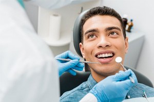 a dentist examining a patient’s teeth