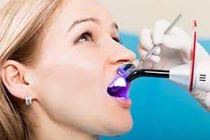 Woman receiving dental bonding treatment