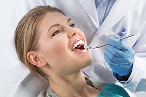 Woman receiving dental exam