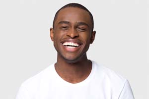Man with beautiful smile after Invisalign in Dallas