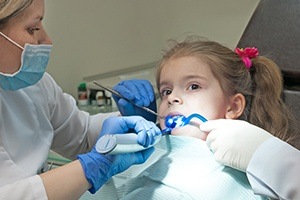 Young girl receiving dental sealants