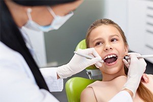 Young girl receiving dental exam