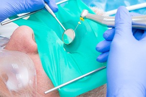 a dentist conducting a root canal on a patient's tooth