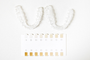 teeth whitening trays next to a shade guide
