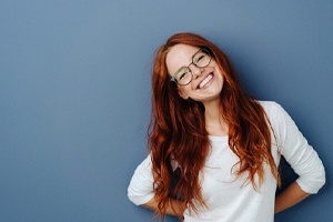 person wearing a white shirt and smiling