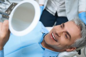 man smiling who just received dental treatment