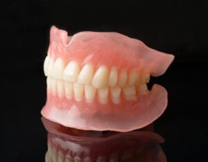 a set of dentures against a black background