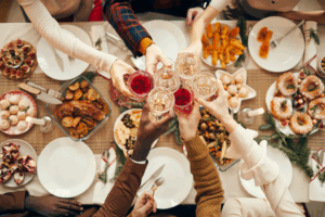 a family cheers-ing over a holiday dinner 